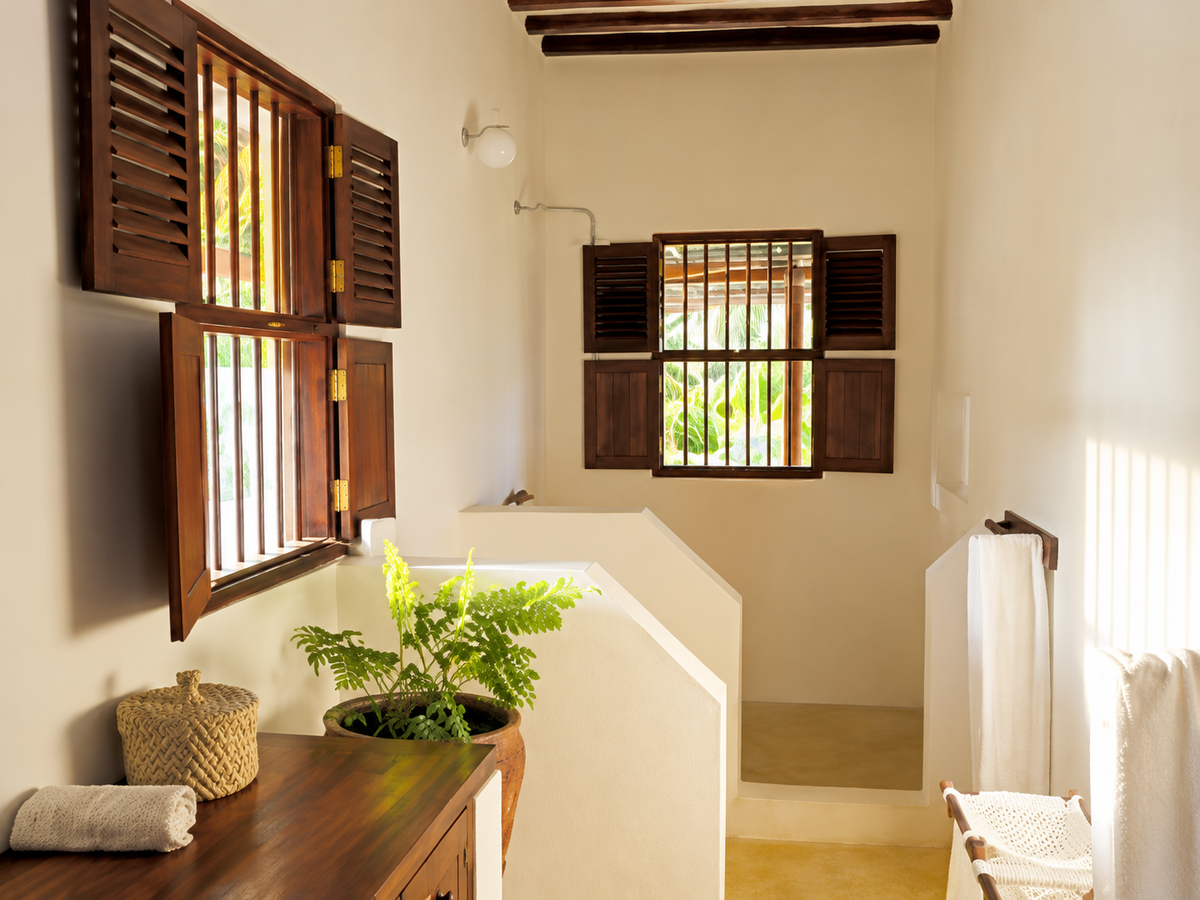 Sunlit bathroom with shutters