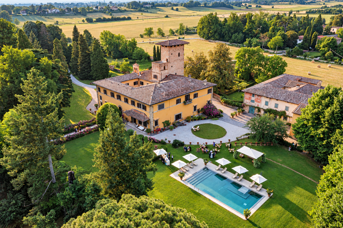 Castello del Monsignore in the Mugello from above, its tower, pool and walled park among fields