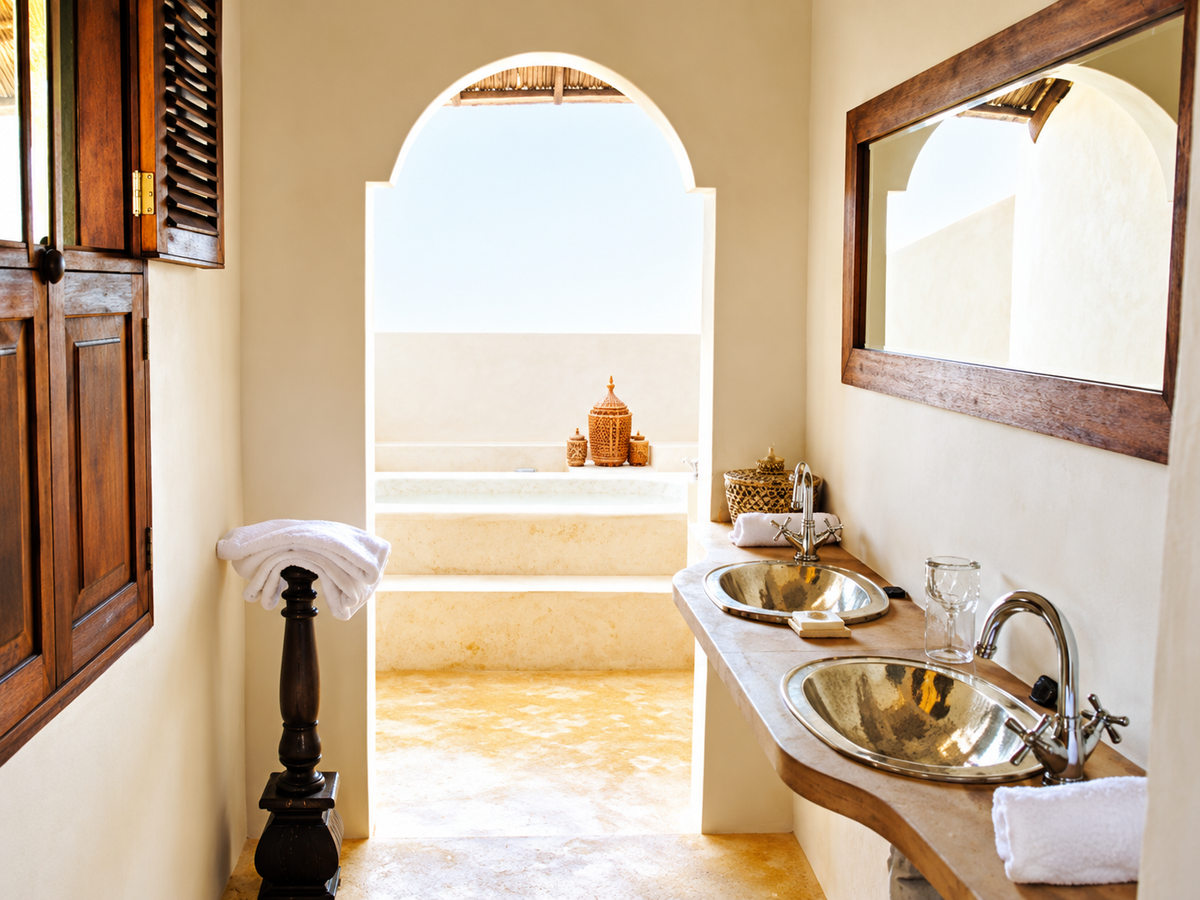 Arched bathroom with copper basins