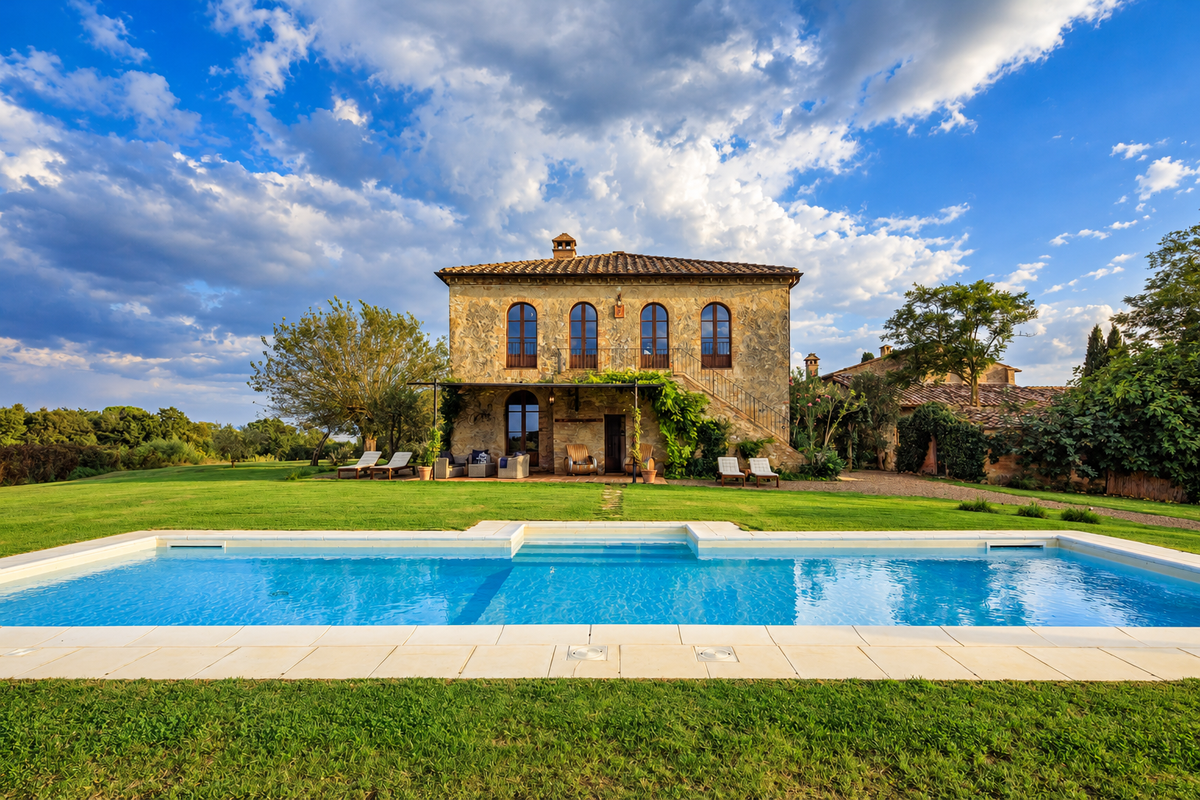 The stone villa reflected in the pool