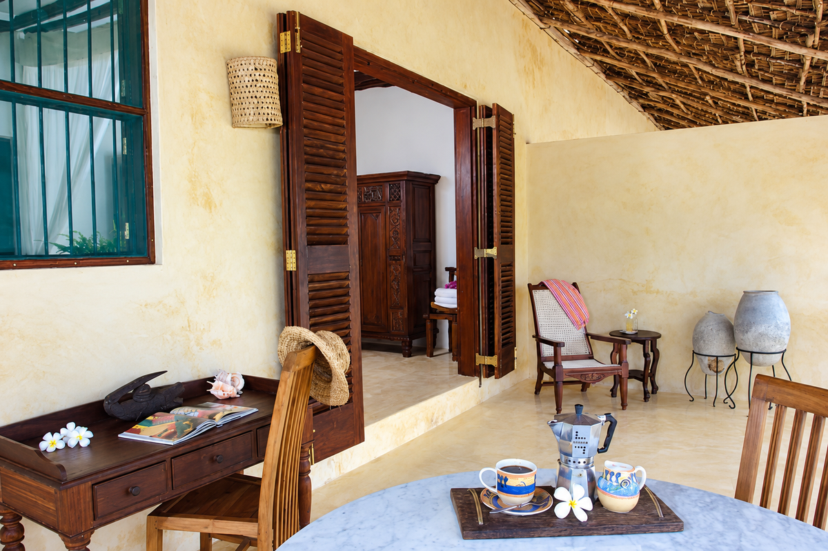 Veranda breakfast tray beside open shutters