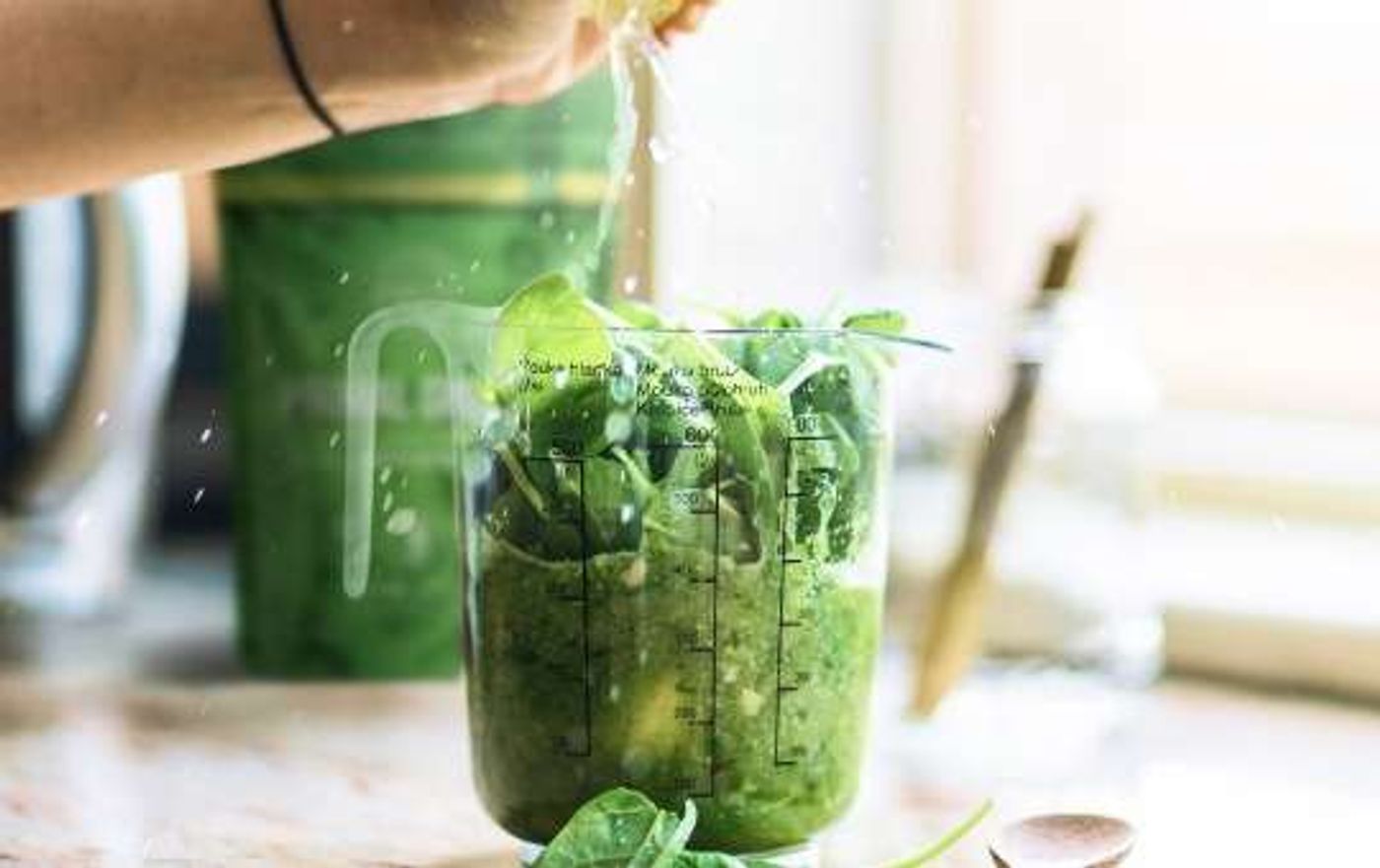 mixing greens drink with primal greens