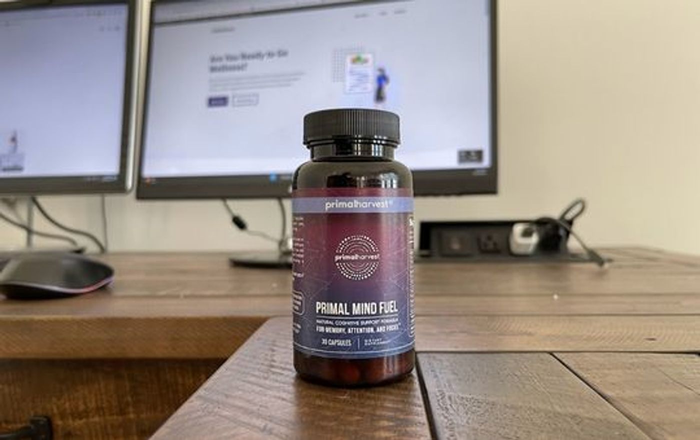 My work desk with a bottle of primal mind fuel supplements