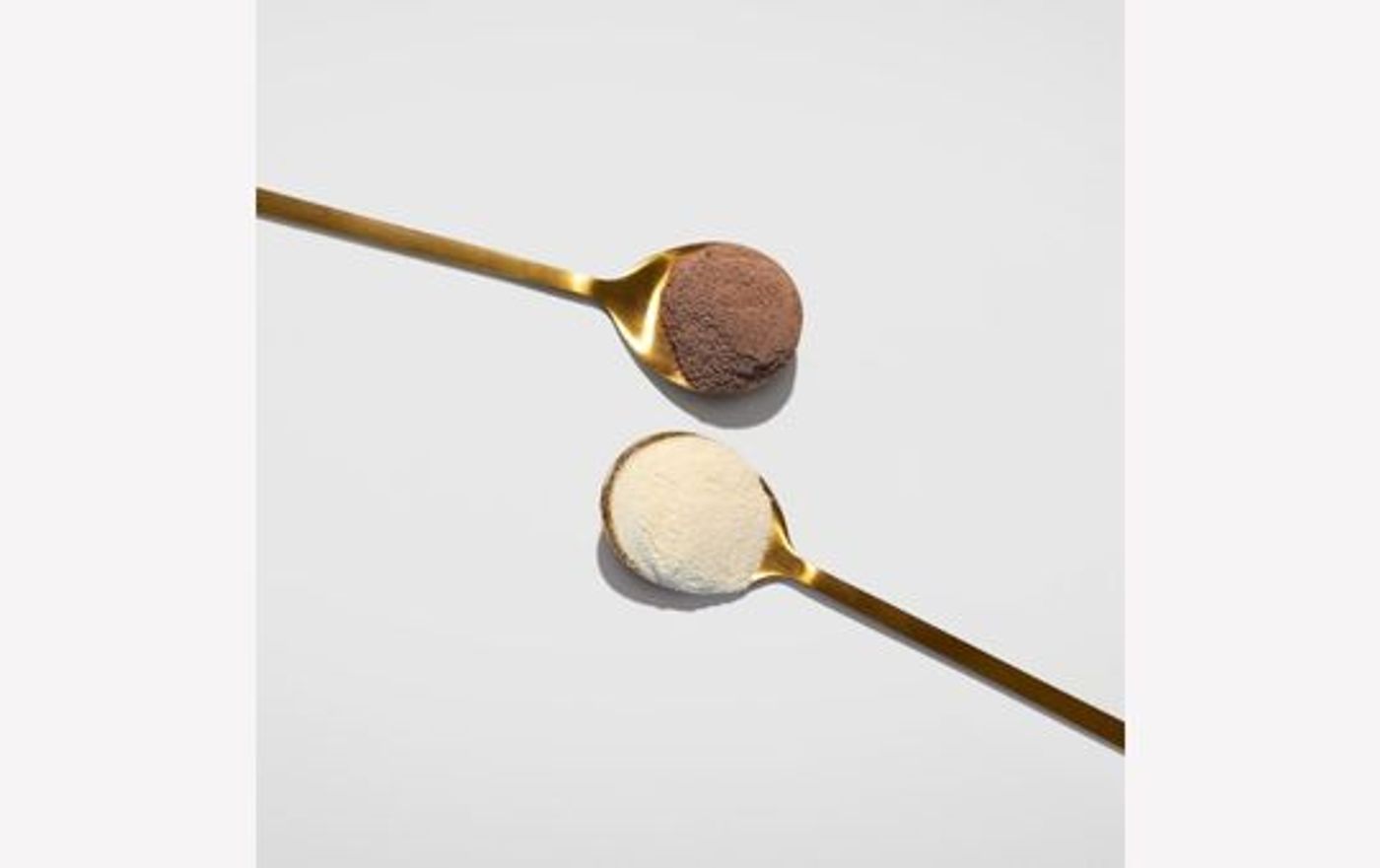 Two different Mindbodygreen collagen mixes in spoons