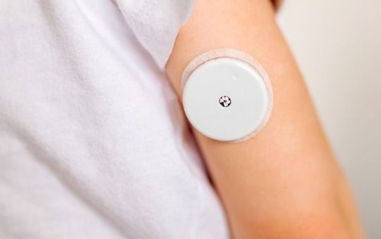 woman wearing cgm