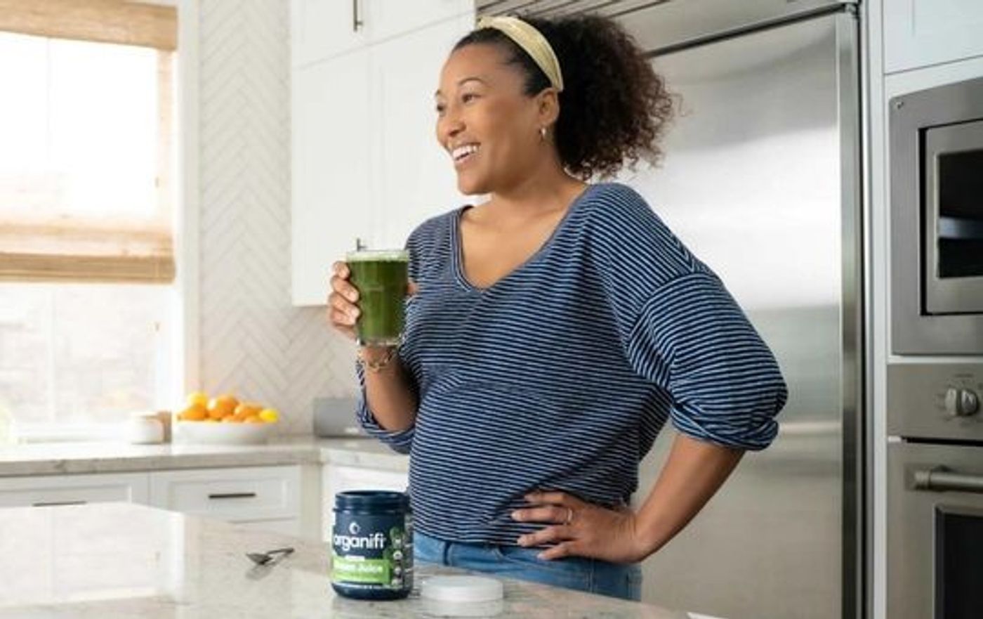 Organifi greens on a kitchen counter.
