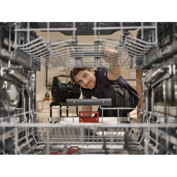 a man repairing dishwasher