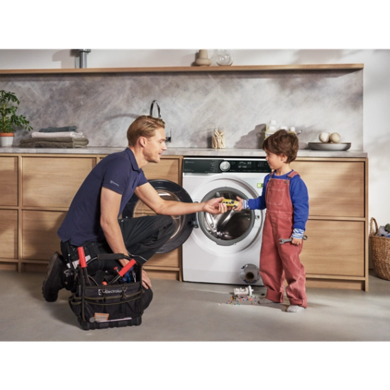 a man repairing washing machine
