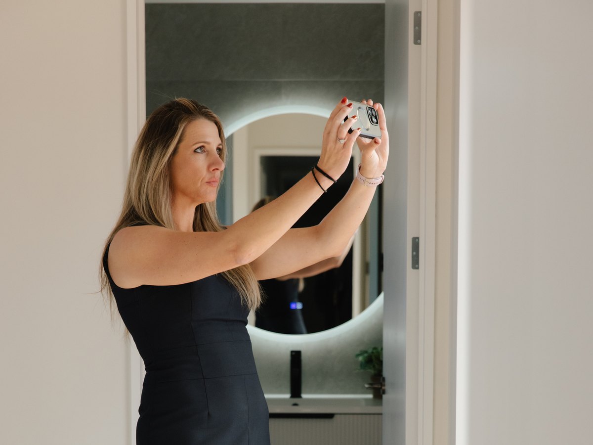 Christchurch TED property manager taking photos of a rental properties interior