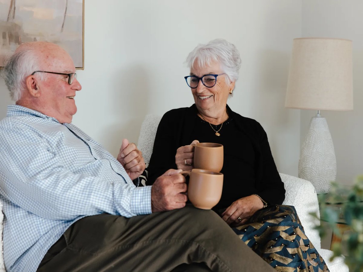 Ted Property Management Tenants sitting on a couch and drinking Tea in their Christchurch rental property