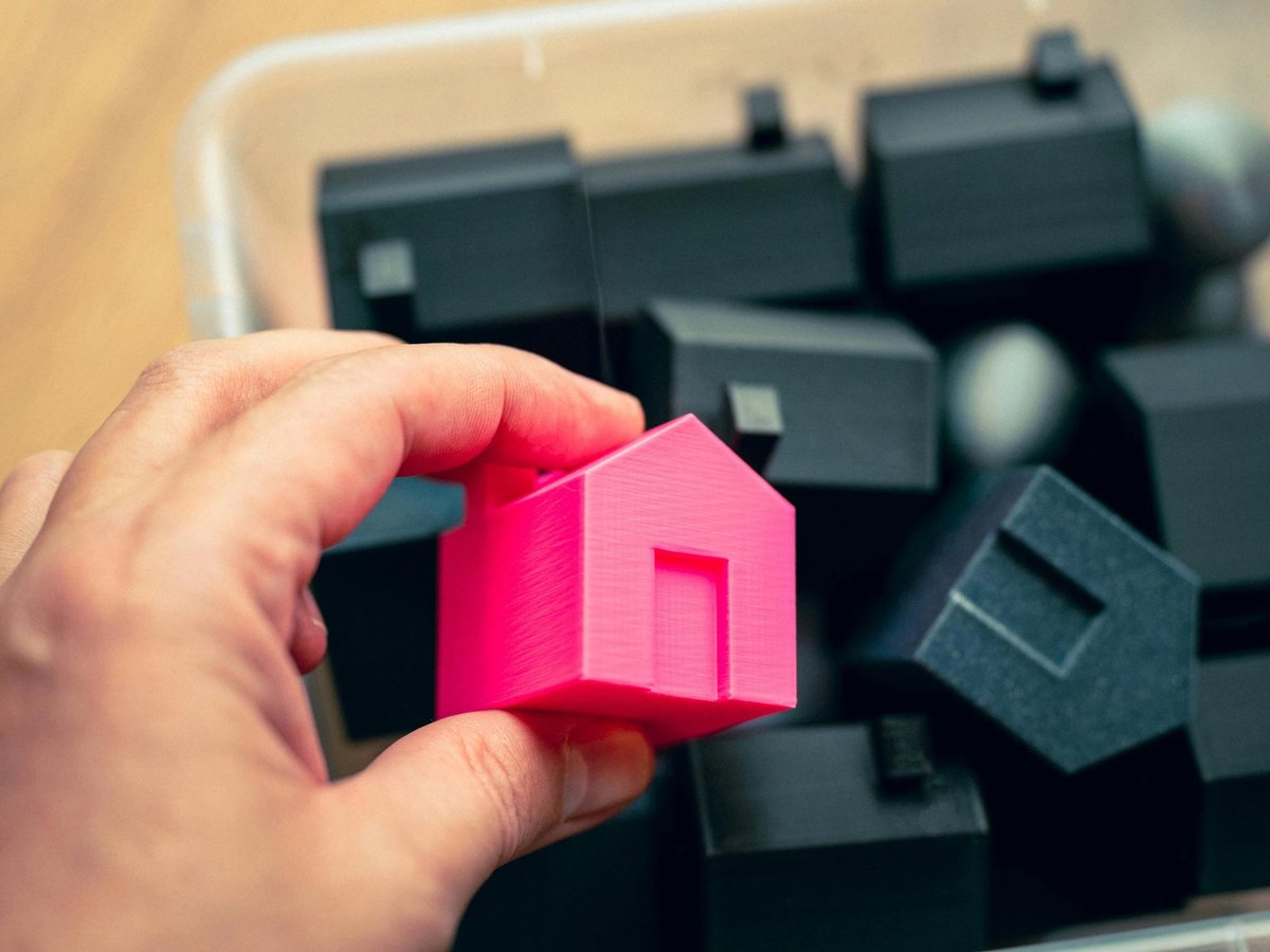 Box of 3D printed plastic houses