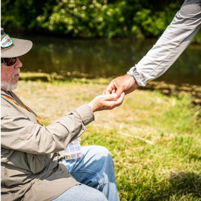 Two men fly fishing tongether