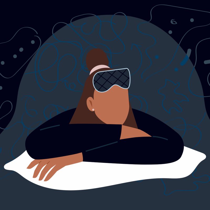 An illustration of a person leaning on a pillow with an eye mask resting on their forehead