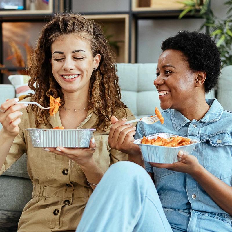 Women enjoying a meal without GERD or acid reflux.