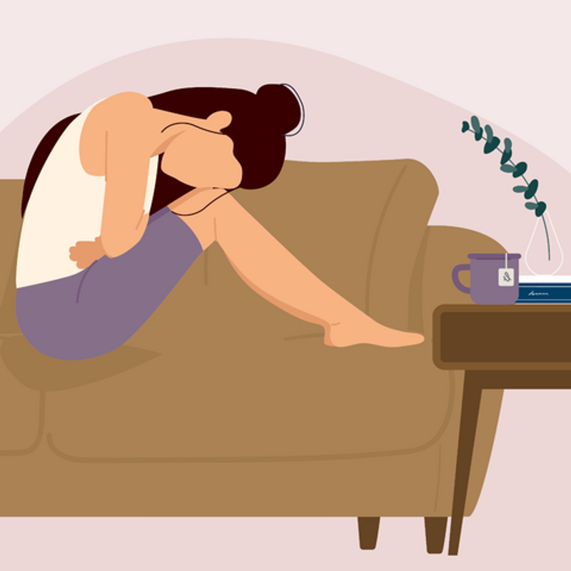 Illustration of woman curled in a ball on a couch.