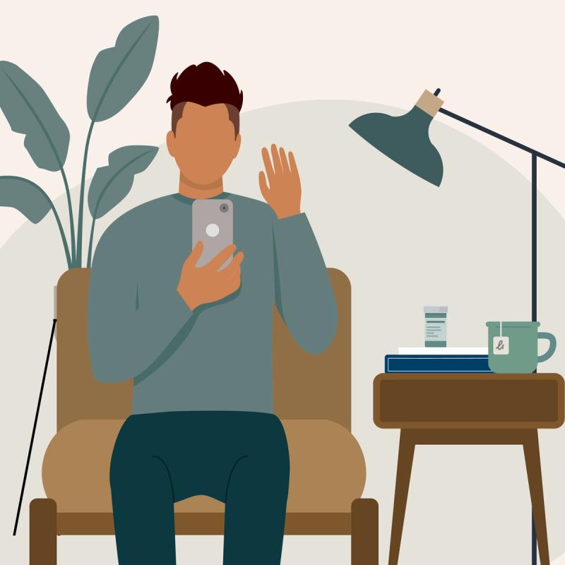 An illustration of a person in a chair having an online therapy session on their phone