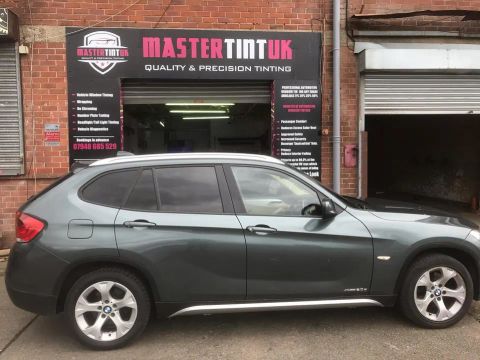 BMW X1 finished outside MasterTint UK on Weston Street, Bolton