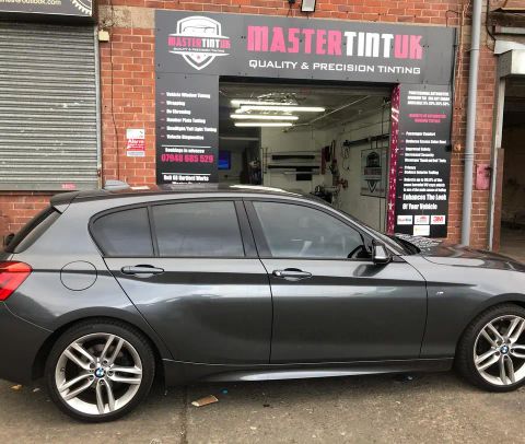 BMW 1 Series finished outside MasterTint UK on Weston Street, Bolton