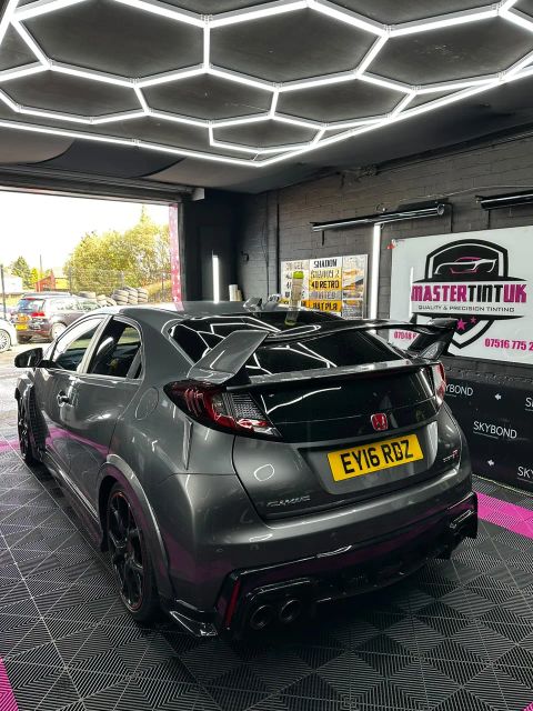 Grey Honda Civic Type R with a dark-tinted rear screen in the MasterTint UK bay, Weston Street, Bolton