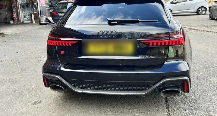 The rear of an Audi RS6 with smoked tail-lights