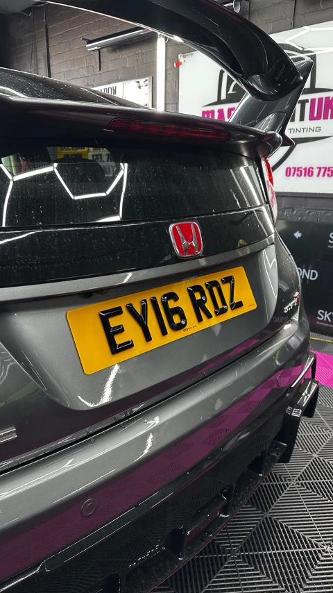 Rear wing and number plate of a grey Honda Civic Type R in the MasterTint UK bay, Weston Street, Bolton