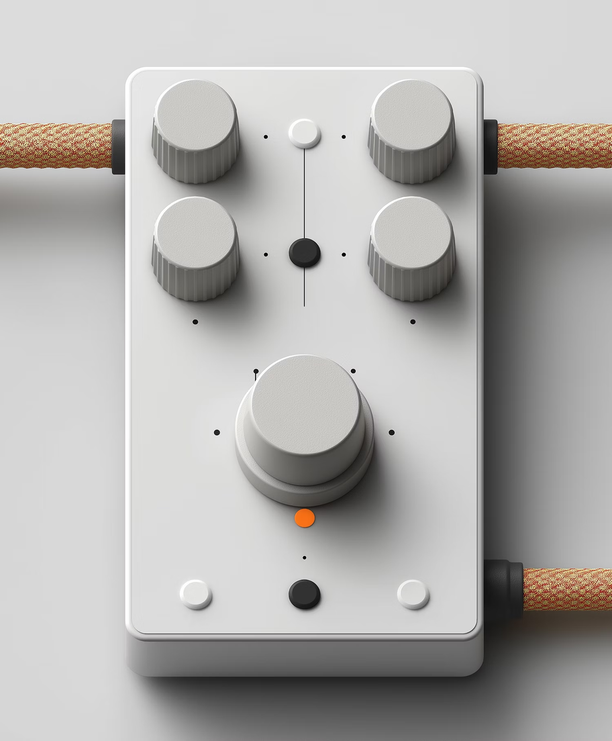 White effects pedal with grey knobs and a braided cable