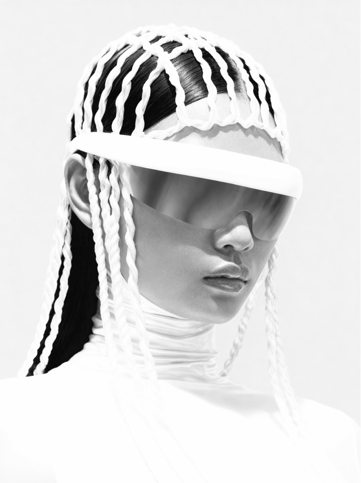Person wearing a white braided headpiece and visor