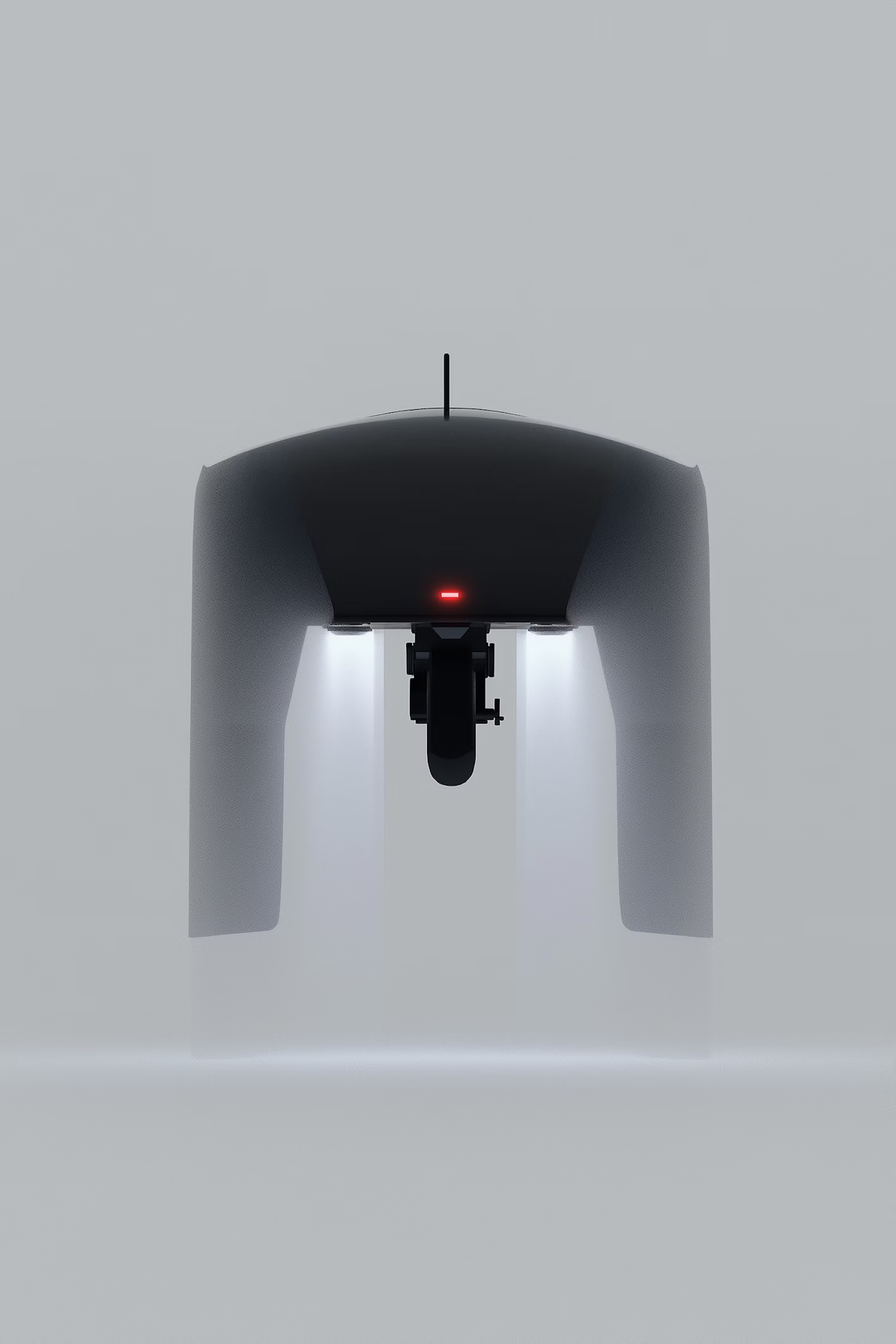 Underside of a grey arched device with two lights and a red indicator