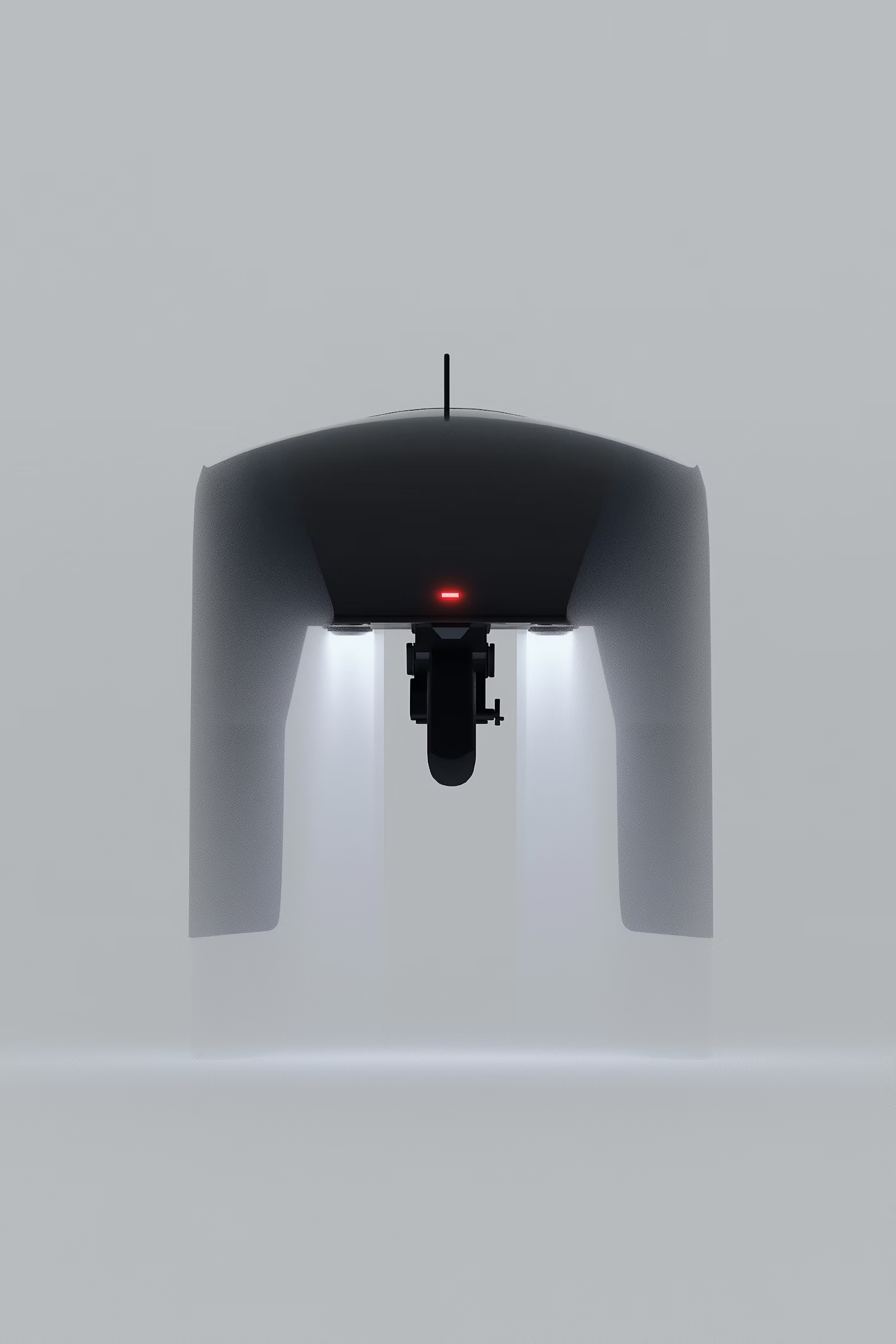 Underside of a grey arched device with two lights and a red indicator
