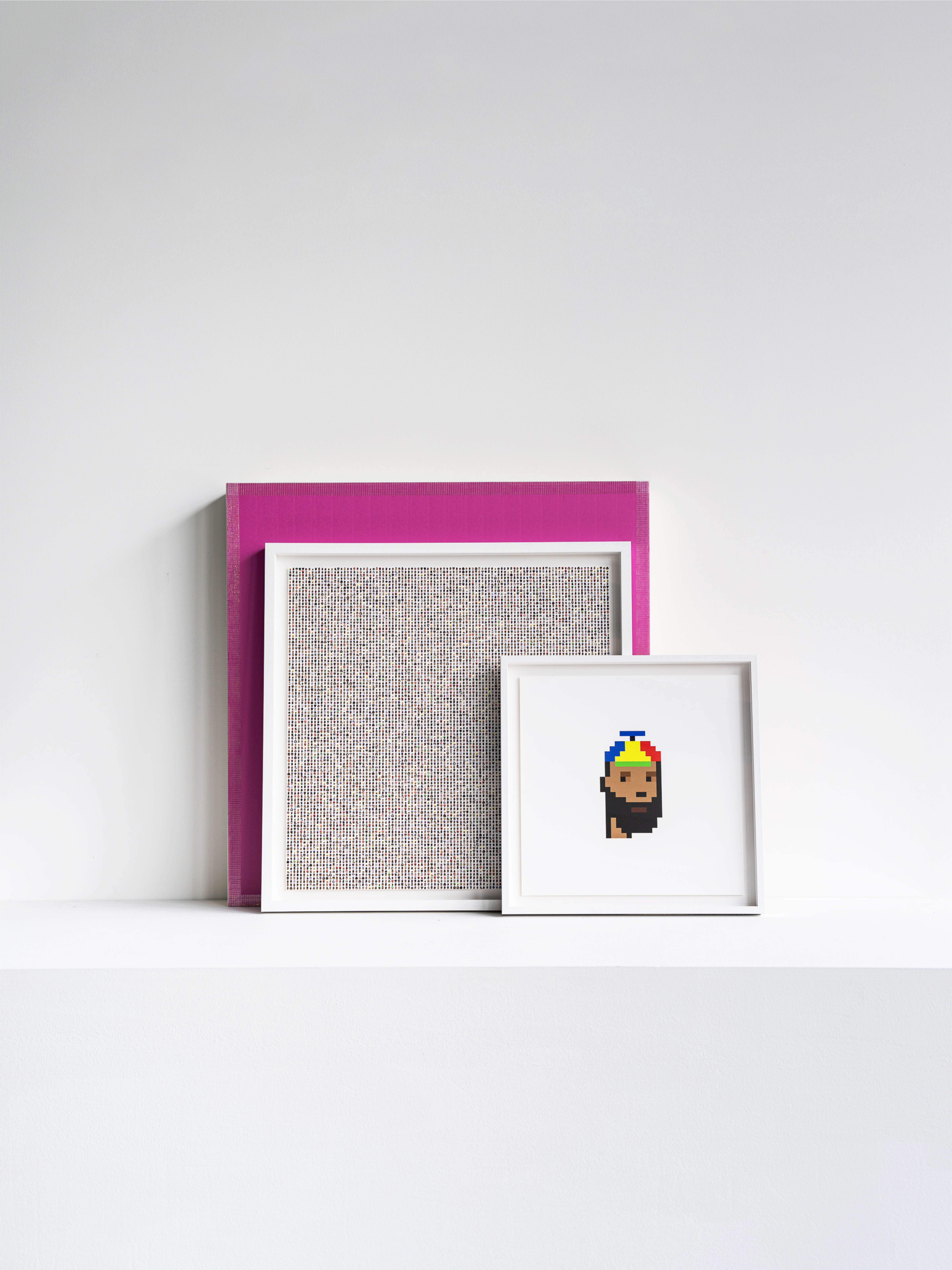 art sat against white wall