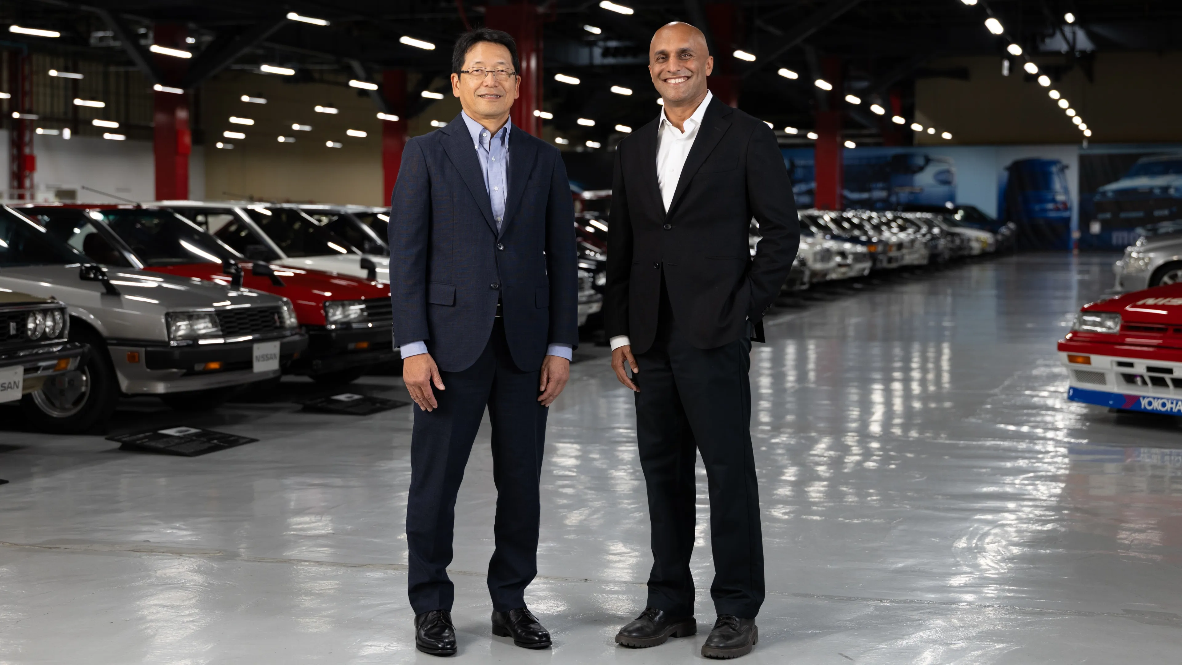 Takashi Yoshizawa of Nissan (left) and Qasar Younis of Applied Intuition at the Nissan Heritage Collection in Zama.