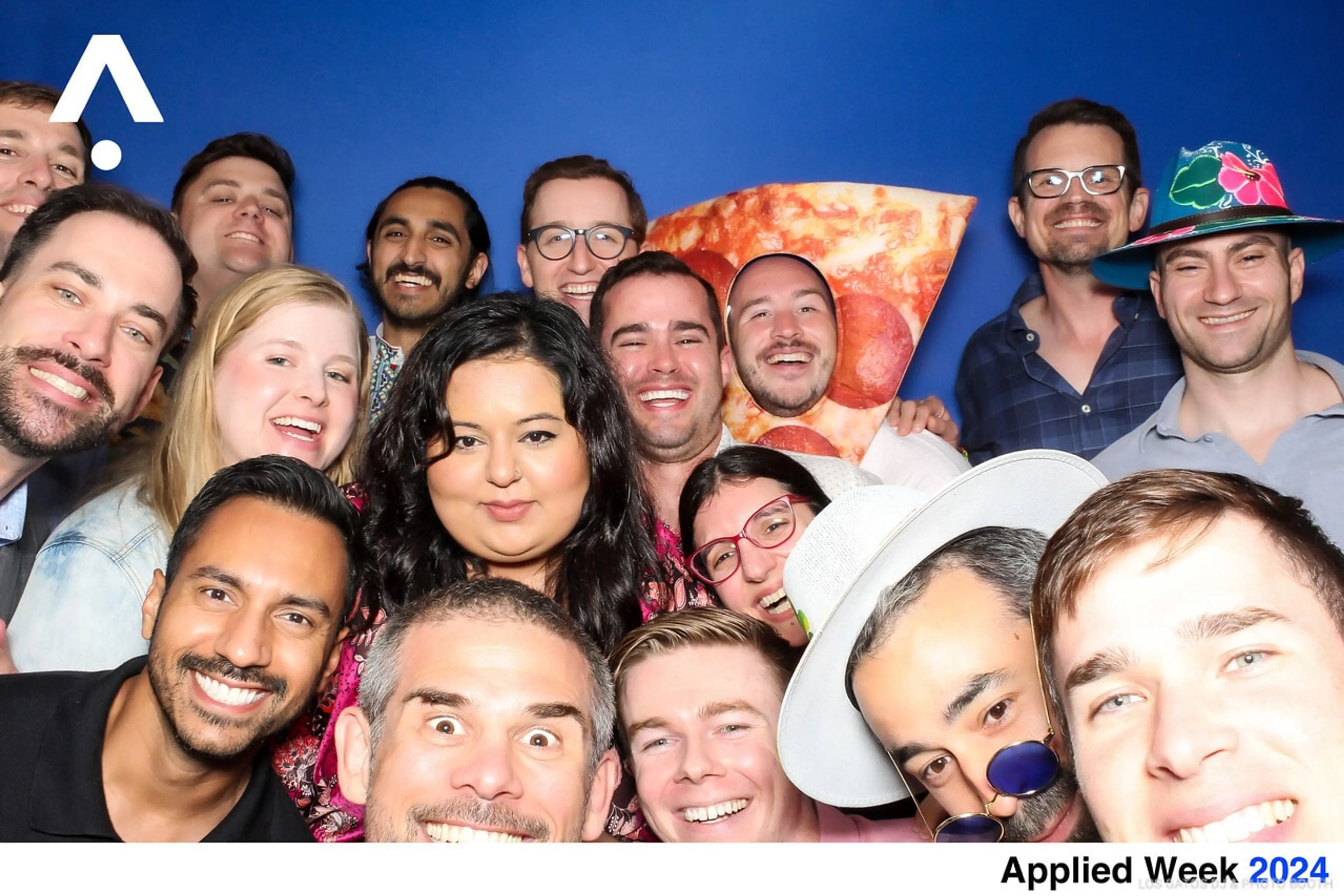 Group of bout 17 people posing for a group photo