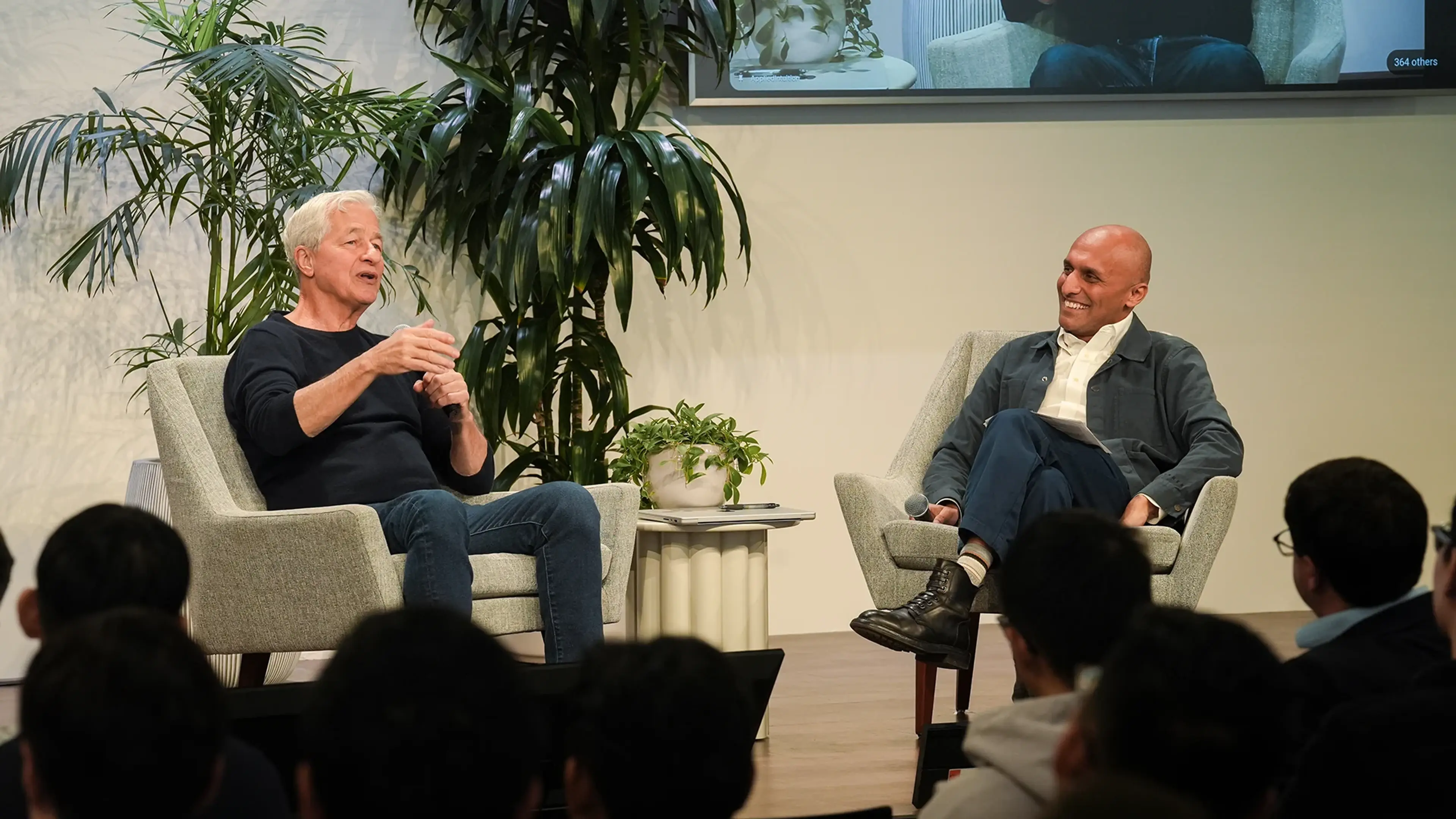 Moderator and guest speaking on stage during a technology leadership talk