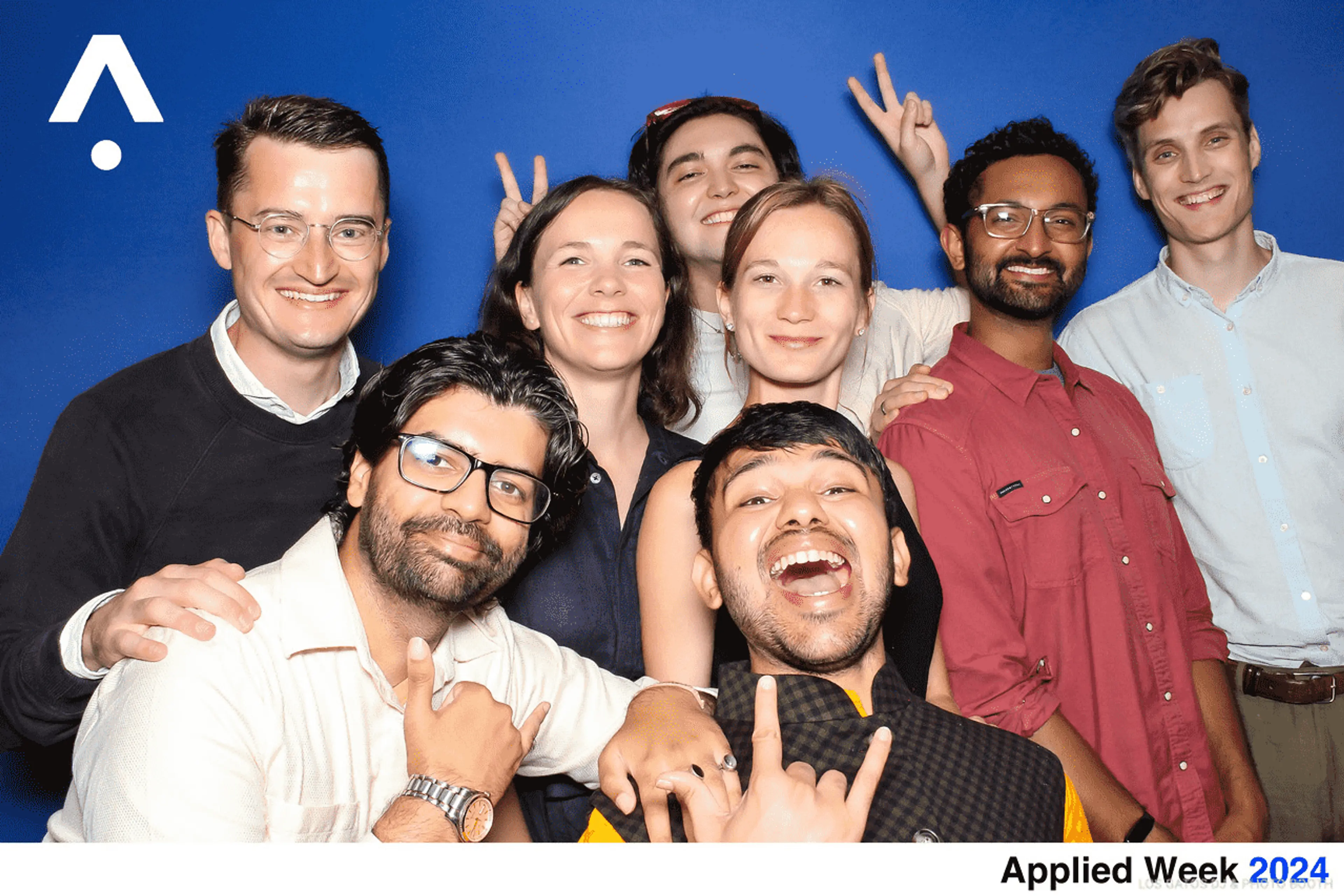 Eight people in a group photo