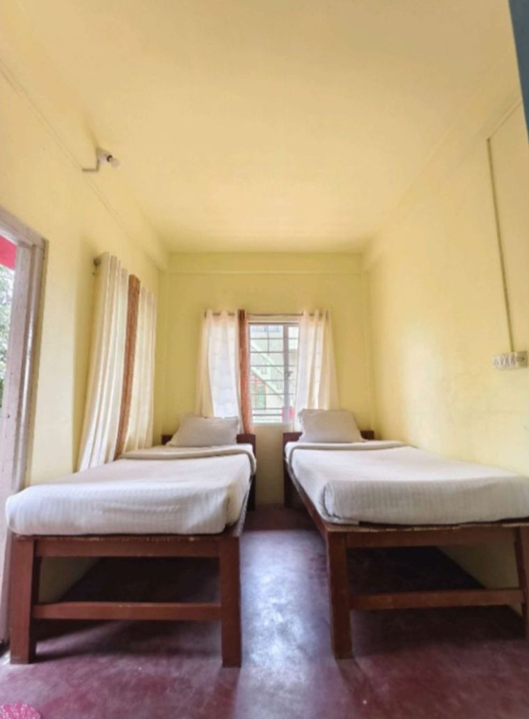 A quiet homestay in Dawki with mountain views.