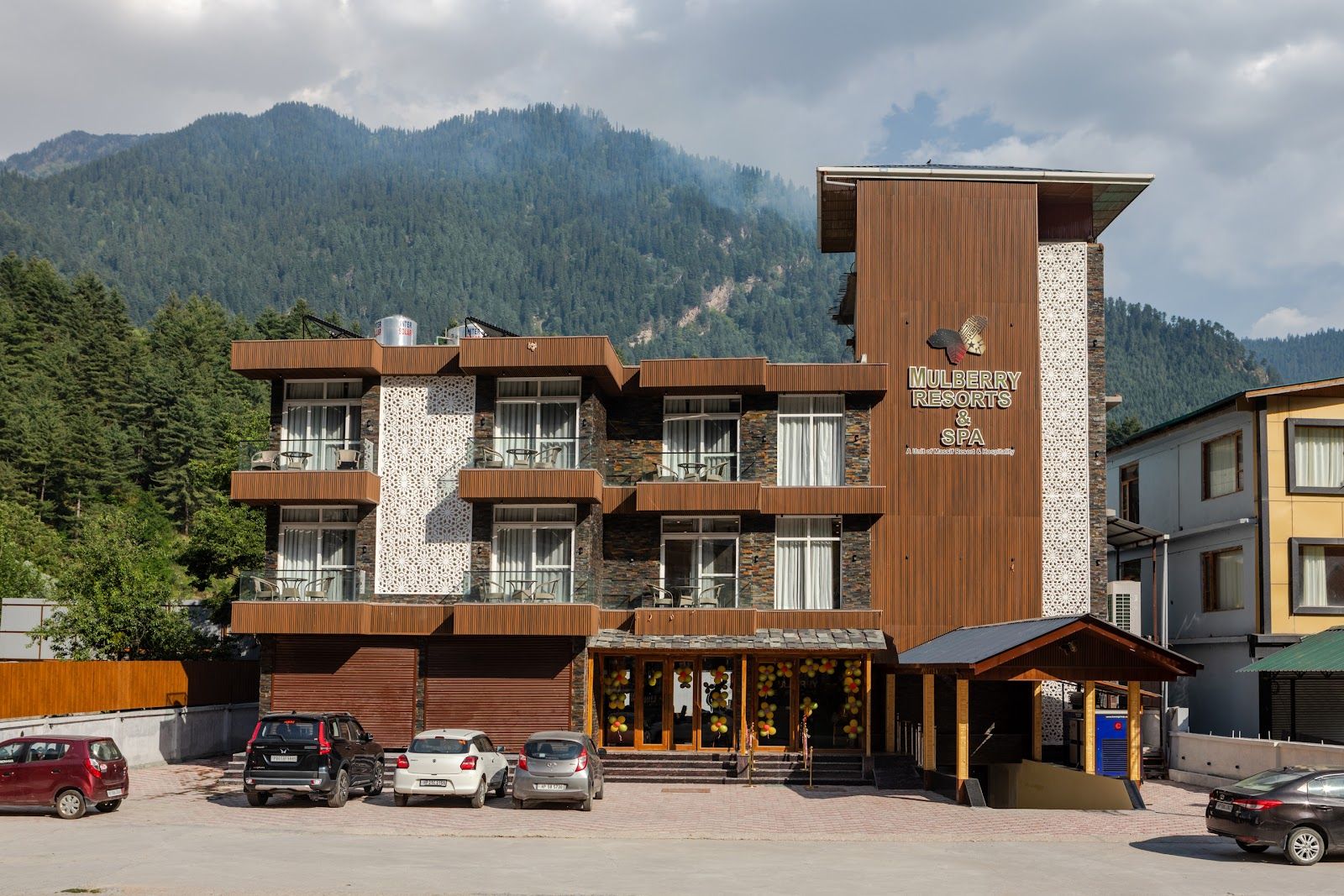 Manali resort with a pool, near the river