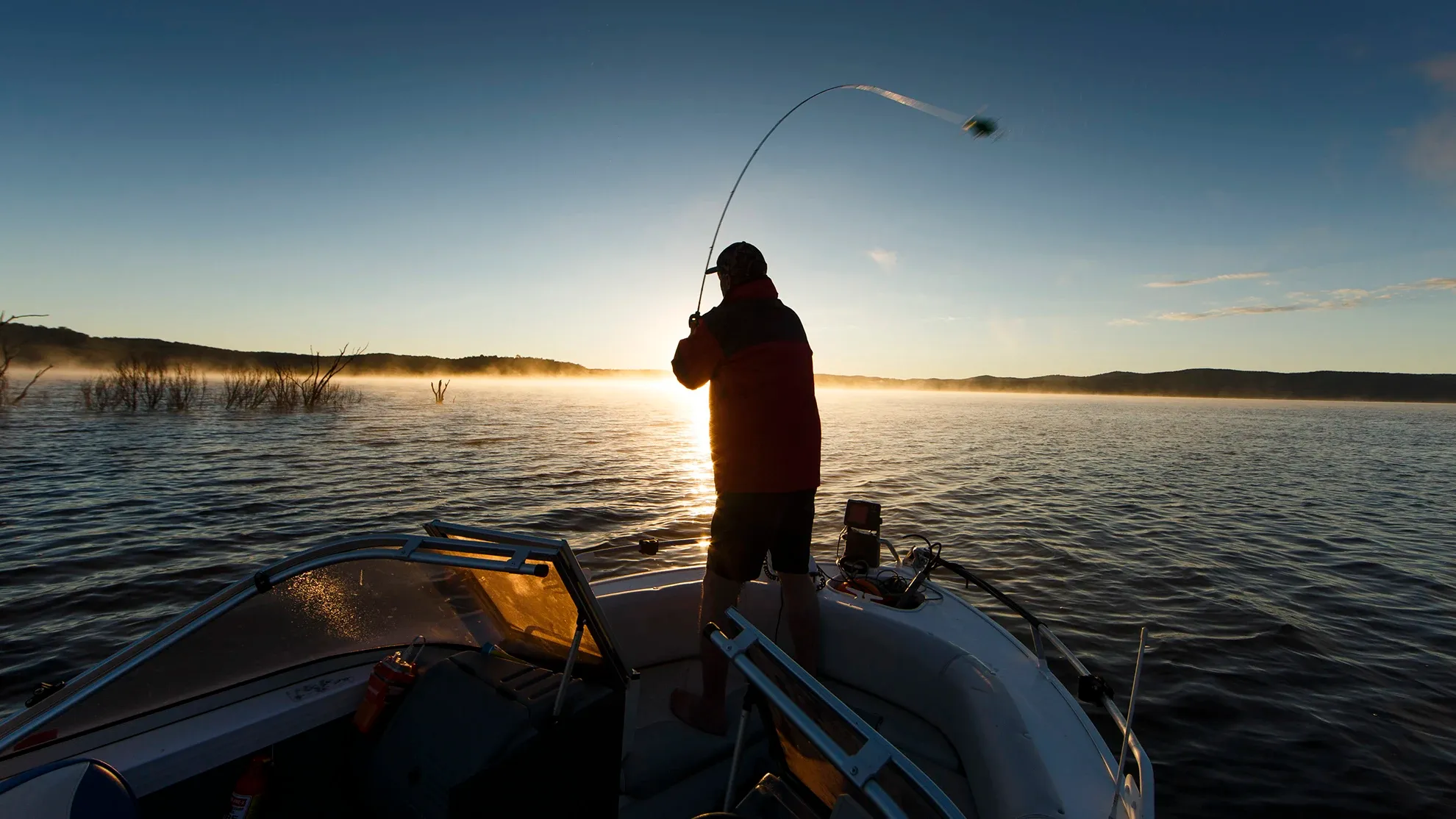 Reflections Holidays Copeton Waters holiday & caravan park man fishing on boat