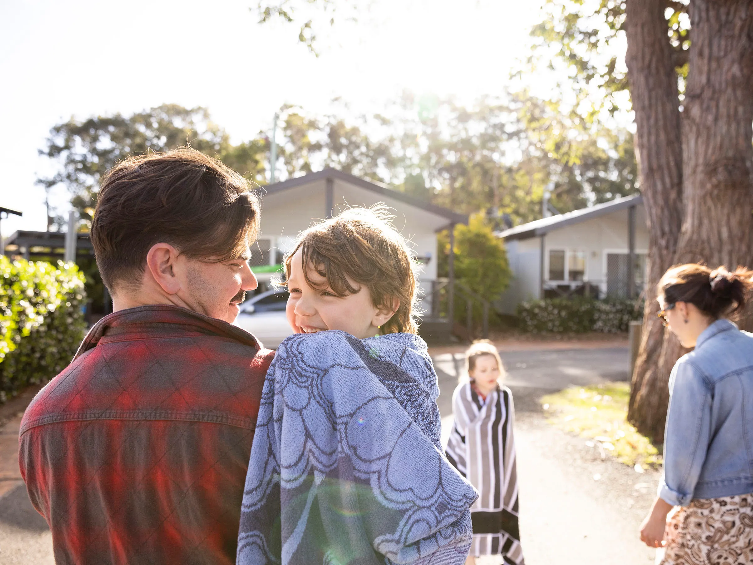 Reflections Holidays Hawks Nest holiday & caravan park family together after swim in the ocean