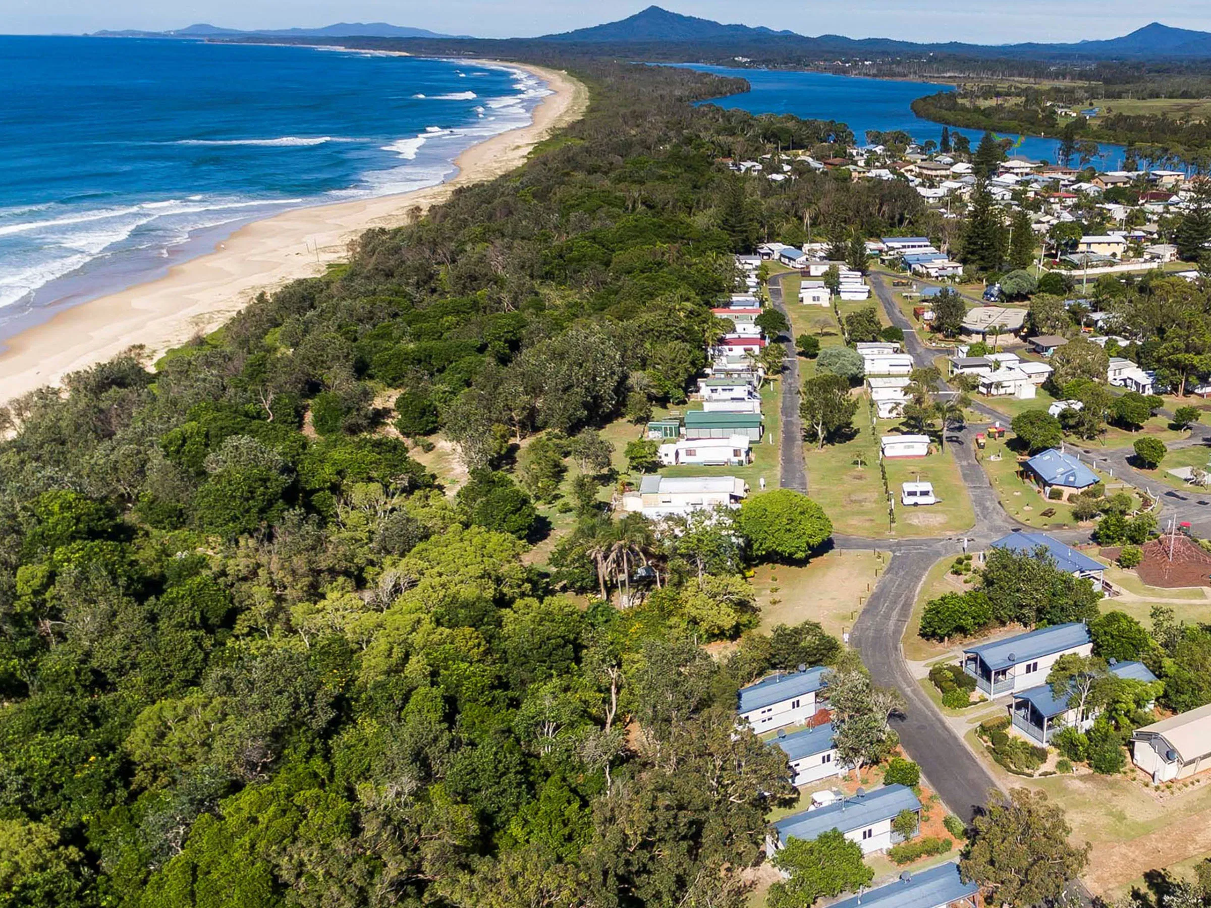 Reflections Mylestom holiday & caravan park drone photo of the caravan park overlooking North Beach