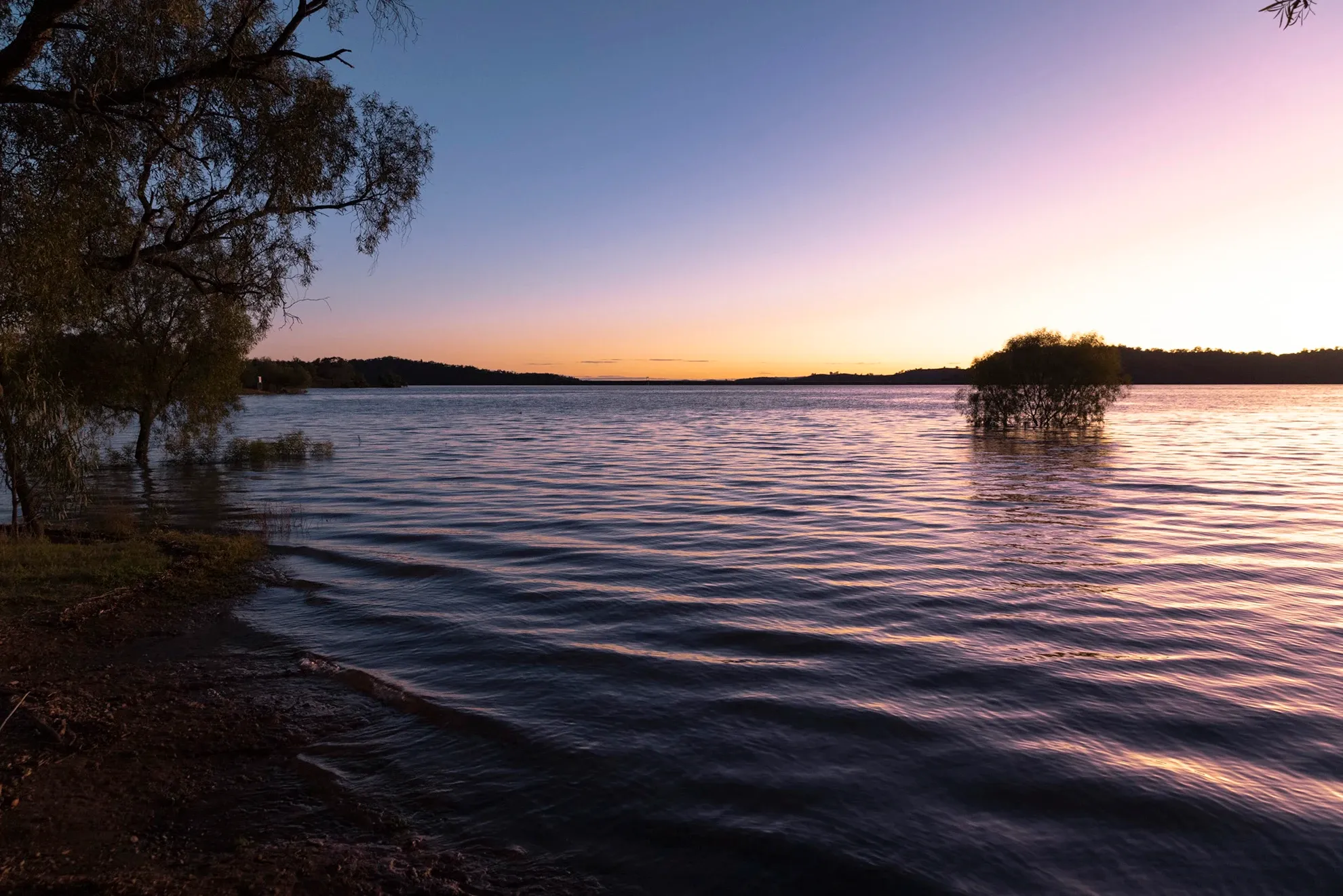 Reflections Holidays Lake Glenbawn caravan park unpowered camping sunset