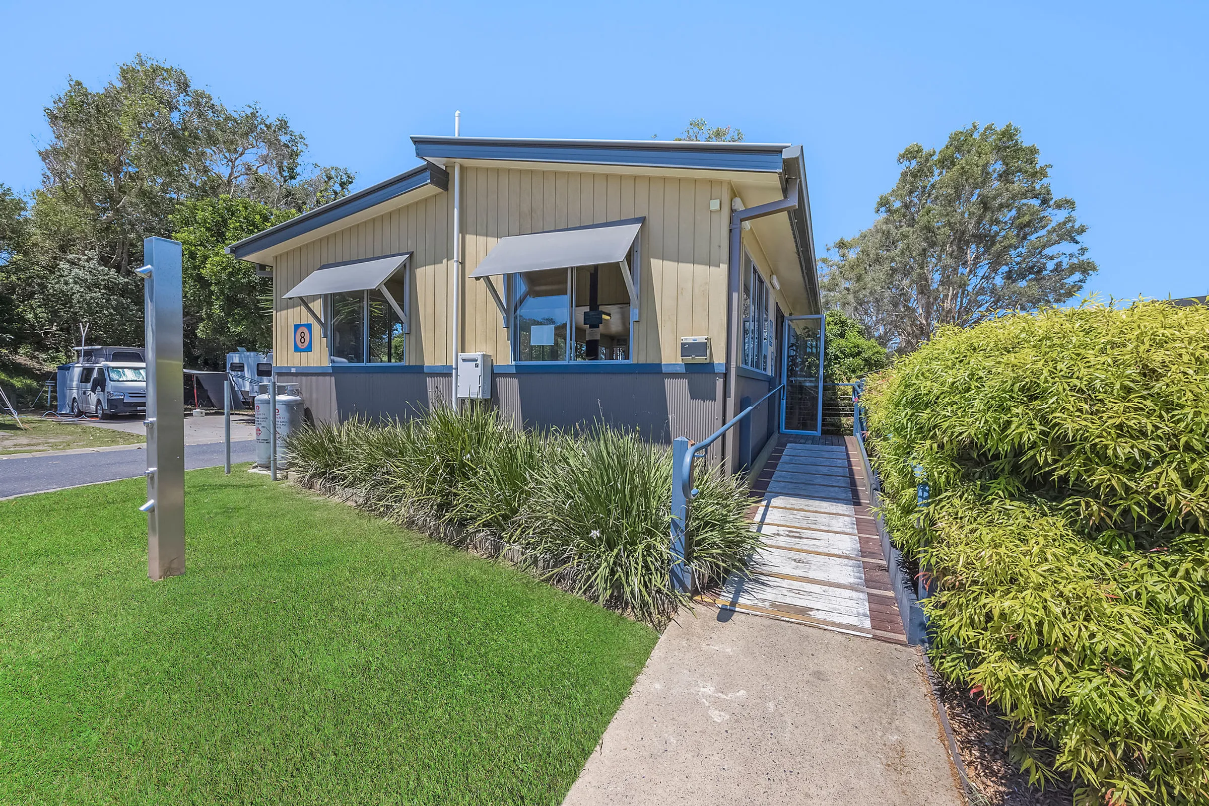 Entrance to the camp kitchen at Reflections Scotts Head, with easy access and modern facilities.