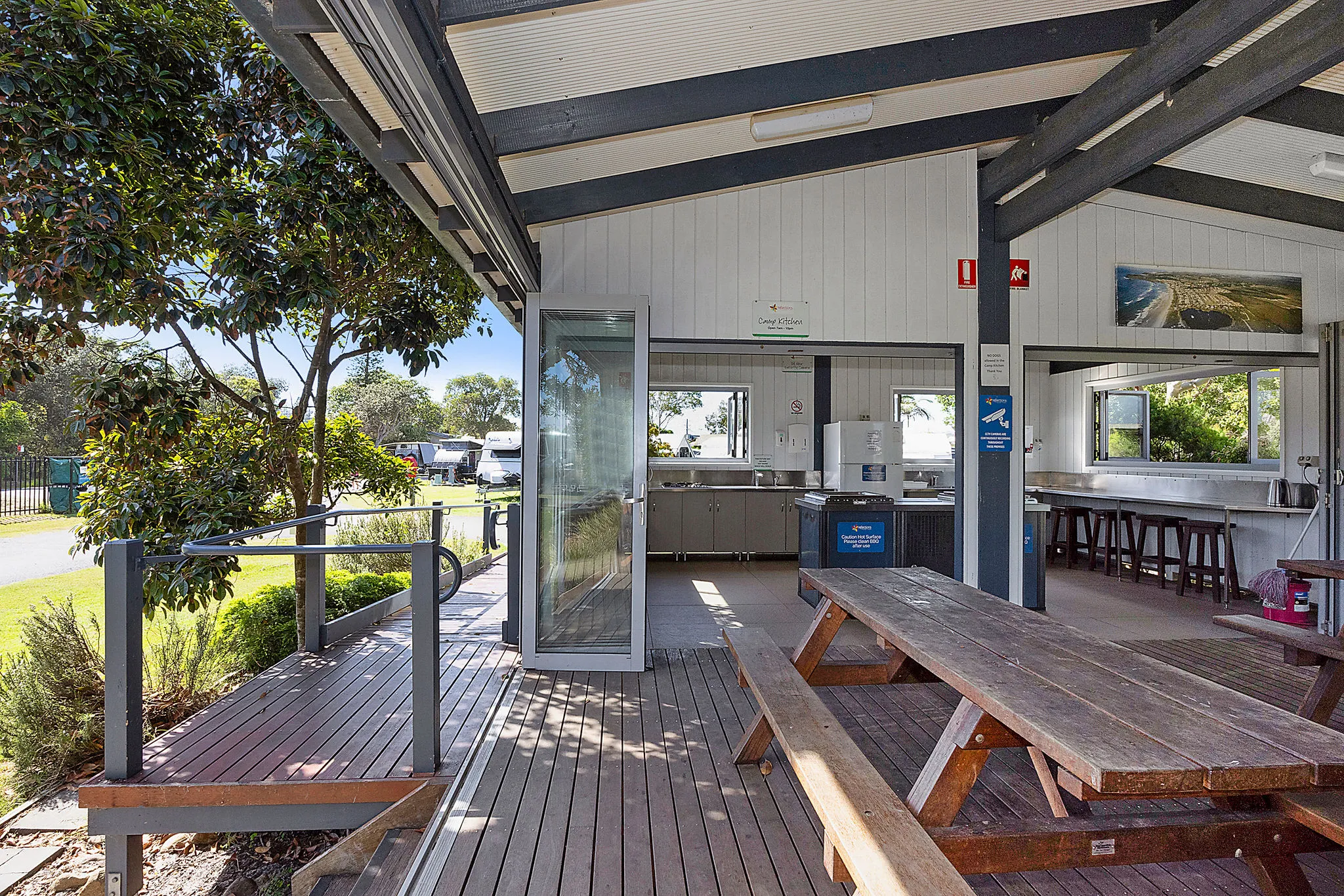 Lennox Head caravan park camp kitchen undercover seating area with bi fold doors