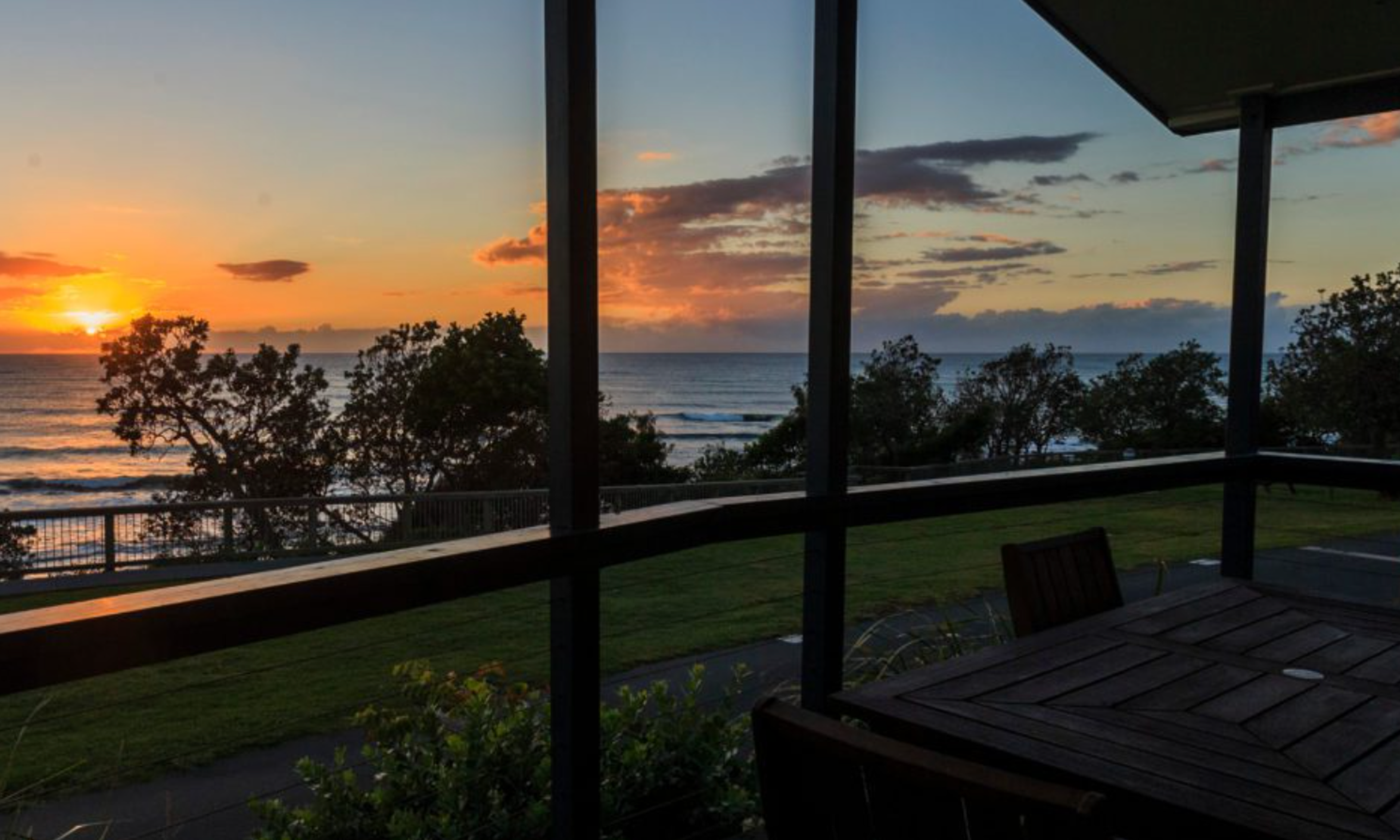 Reflections Holidays Bonny Hills holiday & caravan park sunrise ocean view from cabin accommodation deck