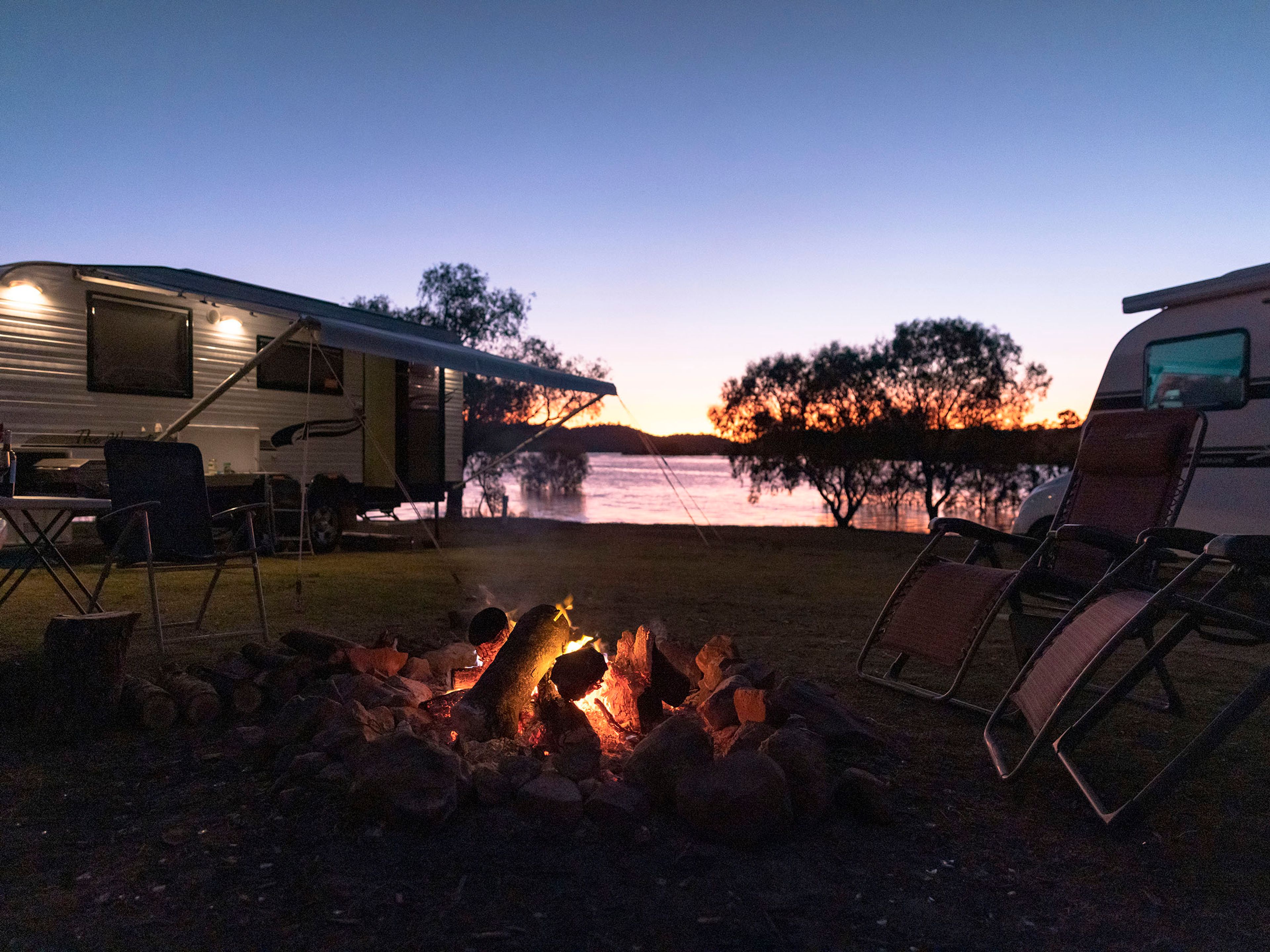 Reflections Holidays Lake Glenbawn caravan park campsite campfire overlooking sunset Hunter River