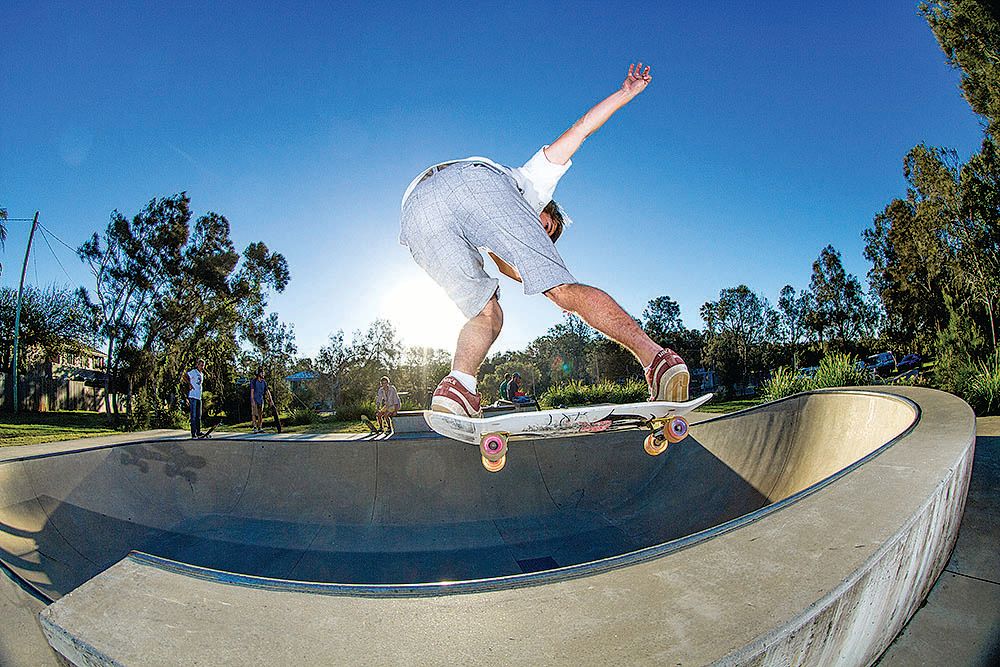 A man skating in a skate park