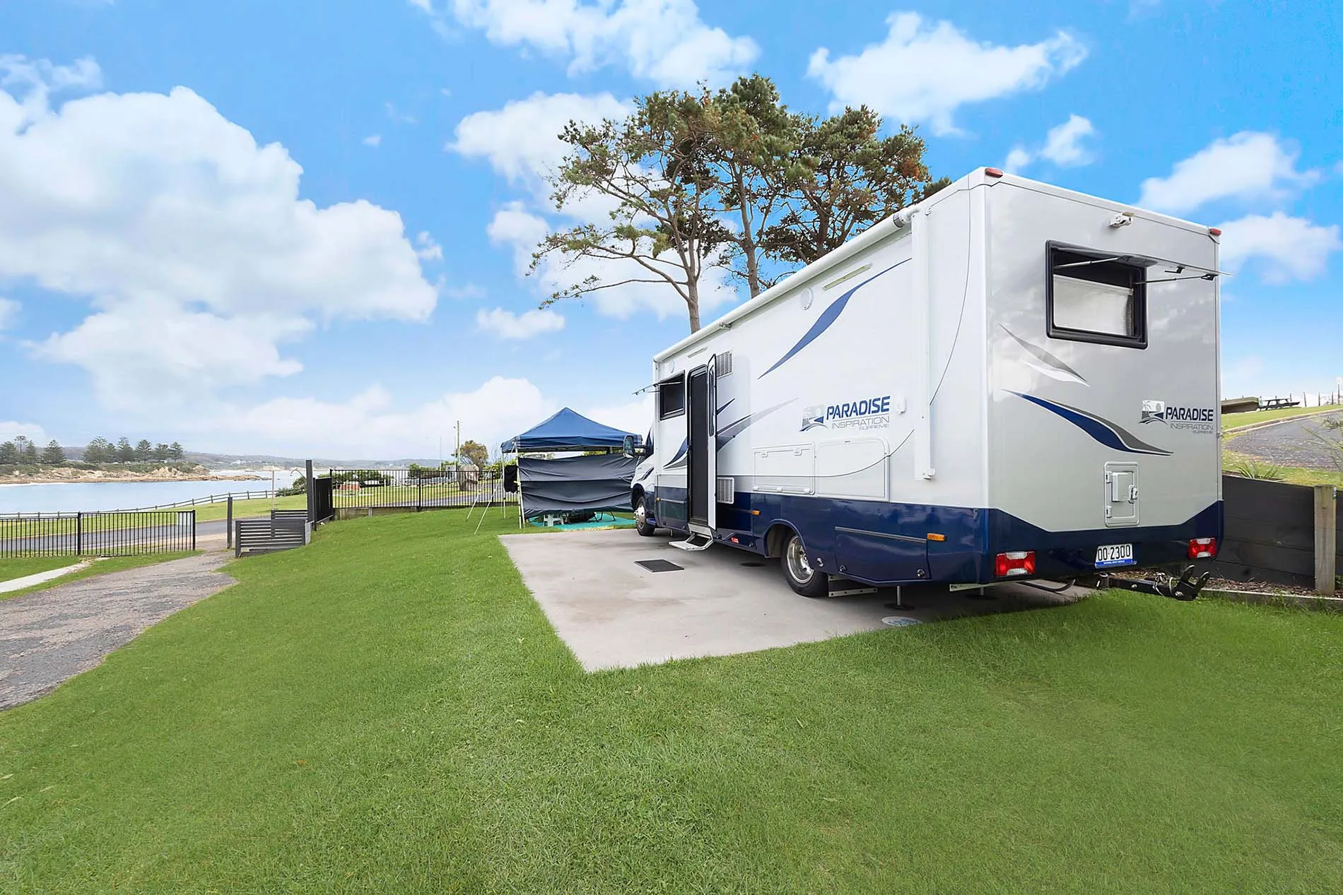 Reflections Bermagui - concrete campsite with Van