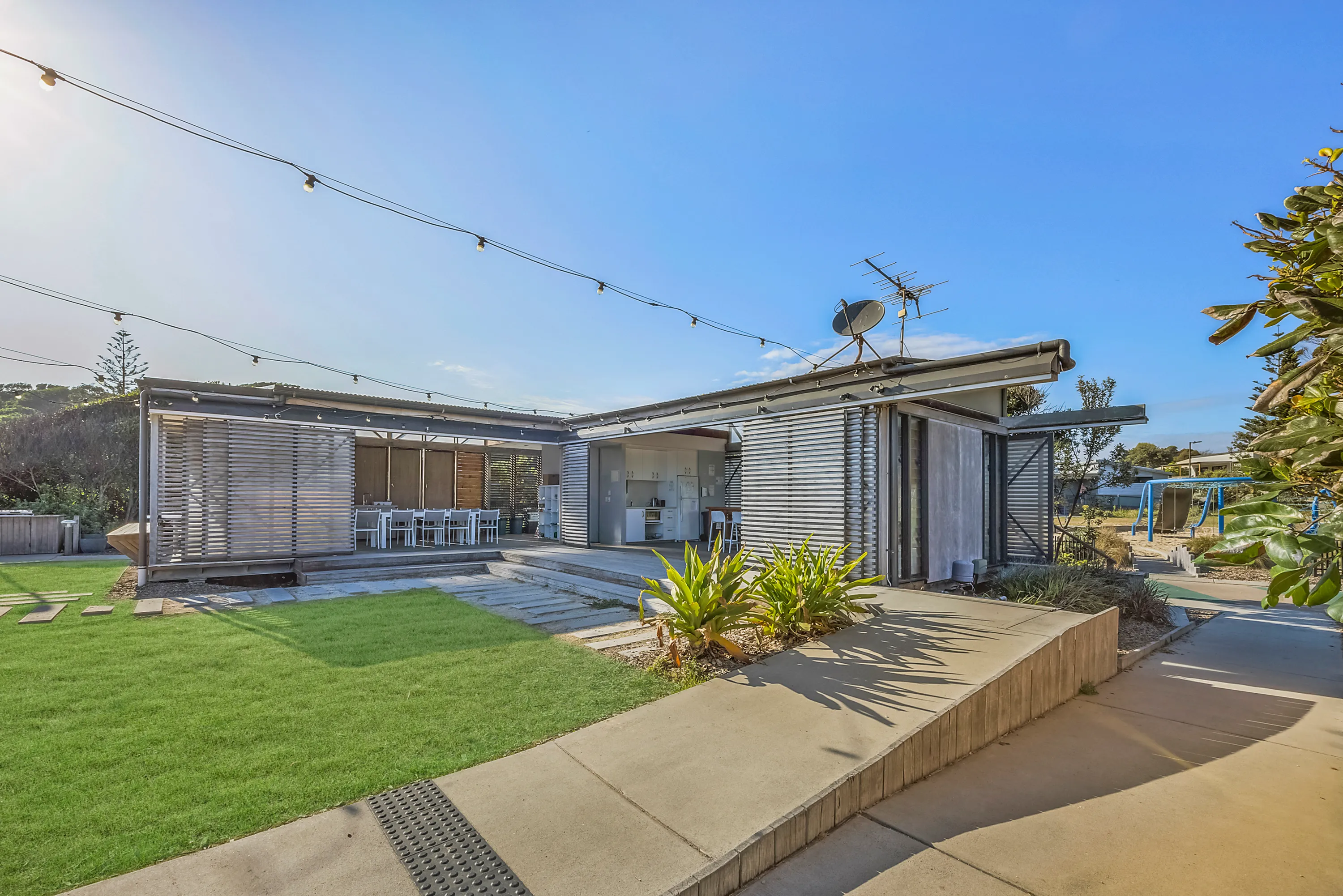 Seal Rocks Caravan Park guest lounge grass area 