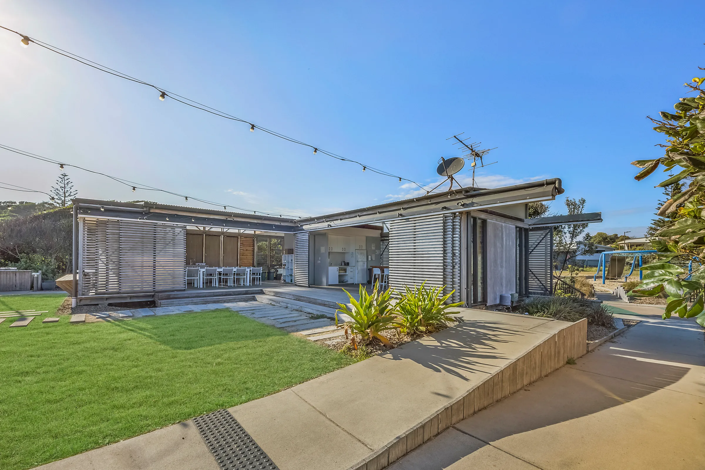 Seal Rocks Caravan Park guest lounge grass area
