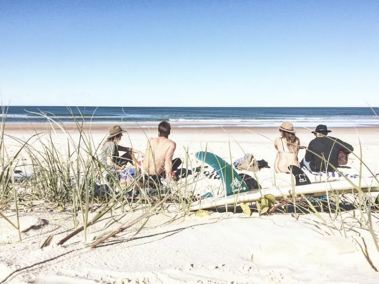 Friends sitting on a beach