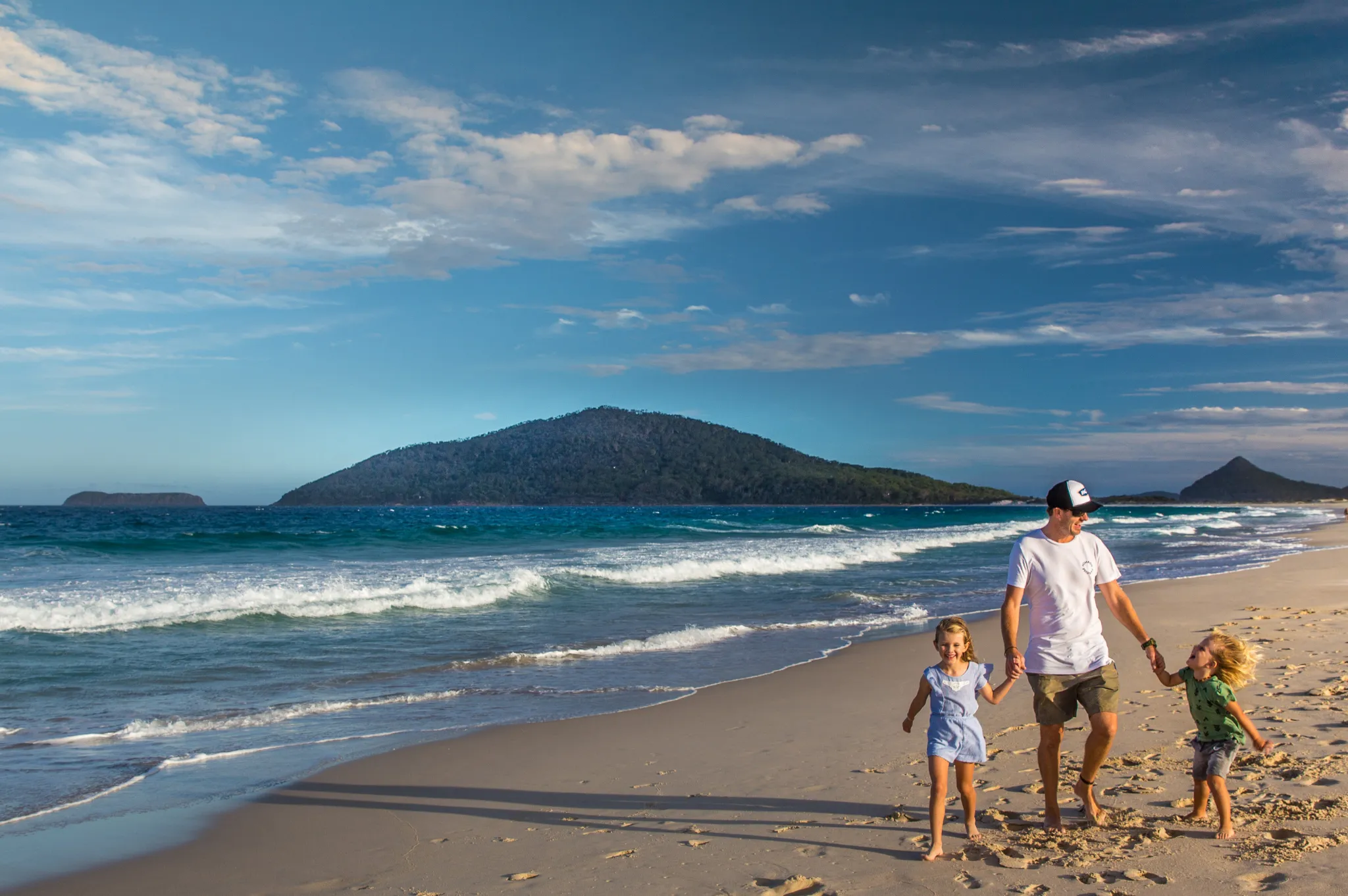 Kids walking on the beach